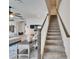 Carpeted staircase features wooden handrail and bright, white risers at 12851 Tortoise Shell Pl, Riverview, FL 33579