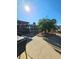 Well landscaped backyard with palm trees and a covered patio area at 13633 Britton Dr, Hudson, FL 34667