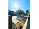 An open backyard with a concrete patio, palm trees, and water access at 13633 Britton Dr, Hudson, FL 34667