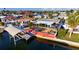 Waterfront home with a boat dock, a gazebo and a nicely landscaped backyard at 13633 Britton Dr, Hudson, FL 34667