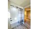 Renovated tub and shower with black hardware and updated finishes at 13633 Britton Dr, Hudson, FL 34667