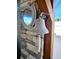 A bell adds a nautical touch to the outdoor bar, making it a great space at 13633 Britton Dr, Hudson, FL 34667
