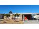 Charming single-story home with a covered parking area and desert landscaping for easy maintenance at 13633 Britton Dr, Hudson, FL 34667