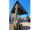 Covered outdoor gazebo with comfortable seating and nice landscaping at 13633 Britton Dr, Hudson, FL 34667