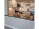 Modern kitchen featuring white cabinets, sleek countertops, and stainless steel appliances at 13633 Britton Dr, Hudson, FL 34667