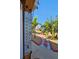 Pathway to waterway with tropical landscaping, decorative rocks, and a thermometer at 13633 Britton Dr, Hudson, FL 34667