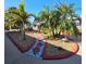 Beautiful landscaping with decorative rocks and winding pathway to waterway at 13633 Britton Dr, Hudson, FL 34667