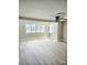 Bright and airy living room with expansive windows and hardwood floors, perfect for relaxation at 13633 Britton Dr, Hudson, FL 34667