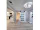 Open-concept living area featuring sliding barn door and kitchen access at 13633 Britton Dr, Hudson, FL 34667