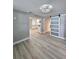 Open-concept living area featuring sliding barn door access to other rooms at 13633 Britton Dr, Hudson, FL 34667