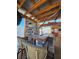 Outdoor bar area with comfortable barstools and rustic finishes at 13633 Britton Dr, Hudson, FL 34667