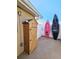 Outdoor storage shed plus kayaks are visible near a white fence, set against a clear blue sky at 13633 Britton Dr, Hudson, FL 34667