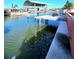 This waterfront area offers serene water views and access, enhancing the property's outdoor appeal and lifestyle at 13633 Britton Dr, Hudson, FL 34667