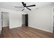 Neutral bedroom featuring white walls, LVP floors, and modern ceiling fan at 13969 Gull Way, Clearwater, FL 33762