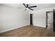 Neutral bedroom showcasing LVP floors, white walls, and stylish dark trim at 13969 Gull Way, Clearwater, FL 33762