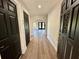Inviting entryway features stylish black doors and beautiful new flooring at 13969 Gull Way, Clearwater, FL 33762