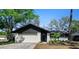Charming single-story home with a well-maintained lawn and a two-car garage at 13969 Gull Way, Clearwater, FL 33762