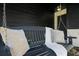 Cozy porch with a charming swing, perfect for relaxing and enjoying the outdoors at 13969 Gull Way, Clearwater, FL 33762