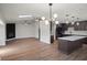Open-concept floorplan with wood floors, skylight, decorative lighting, and modern kitchen at 13969 Gull Way, Clearwater, FL 33762