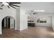 Bright, open-concept living room featuring sleek ceiling fans and modern finishes at 13969 Gull Way, Clearwater, FL 33762