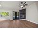 Cozy living room with a modern fireplace and direct access to the pool area at 13969 Gull Way, Clearwater, FL 33762