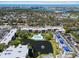 Aerial view of the apartment complex, pool, pond, and Indian Rocks Beach at 14130 Rosemary Ln # 5206, Largo, FL 33774
