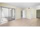 Bright bedroom with tile flooring and large sliding glass door at 14130 Rosemary Ln # 5206, Largo, FL 33774