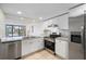 Renovated kitchen with stainless steel appliances, granite countertops and new cabinets at 14130 Rosemary Ln # 5206, Largo, FL 33774