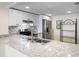 Modern kitchen with granite countertops, stainless steel appliances, and white cabinetry at 14130 Rosemary Ln # 5206, Largo, FL 33774
