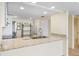 Updated kitchen boasting granite countertops, stainless steel sink, and ample counter space at 14130 Rosemary Ln # 5206, Largo, FL 33774