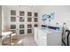 Laundry room featuring lockers and two washing machines at 14130 Rosemary Ln # 5206, Largo, FL 33774