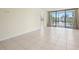 Tile flooring and large glass sliding door enhances the natural light in the space at 14130 Rosemary Ln # 5206, Largo, FL 33774