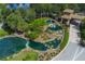 Aerial view of the lush landscaping, lakes, water features, and gatehouse at Valencia Lakes at 16145 Amethyst Key Dr, Wimauma, FL 33598