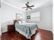 Cozy bedroom with a comfortable bed, ceiling fan, and plenty of natural light at 16145 Amethyst Key Dr, Wimauma, FL 33598