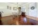 Cozy dining area with a glass-top table and views of the front entryway at 16145 Amethyst Key Dr, Wimauma, FL 33598