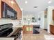 Bright and functional kitchen featuring stainless steel appliances, light countertops, and open layout for easy movement at 16145 Amethyst Key Dr, Wimauma, FL 33598