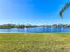 Picturesque lake view with lush green lawn at 16145 Amethyst Key Dr, Wimauma, FL 33598