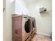 Laundry room with modern washer and dryer at 16145 Amethyst Key Dr, Wimauma, FL 33598