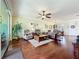 Comfortable living room showcases hardwood floors, neutral paint, fan, and ample seating options at 16145 Amethyst Key Dr, Wimauma, FL 33598
