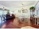 Inviting living area with hardwood floors, comfortable seating, and natural light at 16145 Amethyst Key Dr, Wimauma, FL 33598