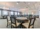 Large meeting room with game tables, seating, decorative lighting, and elegant wall decor at 16145 Amethyst Key Dr, Wimauma, FL 33598