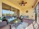 Spacious screened patio with comfortable seating, perfect for relaxing near the lake at 16145 Amethyst Key Dr, Wimauma, FL 33598
