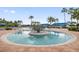 Resort-style zero entry pool with mature landscaping, shade and plenty of space for relaxing with Gathering and friends at 16145 Amethyst Key Dr, Wimauma, FL 33598