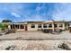 Large outdoor patio for entertainment and dining, complemented by a well-maintained backyard at 1710 New Bedford Dr, Sun City Center, FL 33573