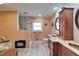 Bathroom featuring double sinks, granite countertops, and a tiled shower for a luxurious experience at 1710 New Bedford Dr, Sun City Center, FL 33573