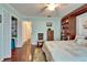 Bedroom featuring hardwood floors and access to closet and storage at 1710 New Bedford Dr, Sun City Center, FL 33573