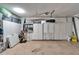 Spacious garage with ample storage cabinets providing organization and functionality at 1710 New Bedford Dr, Sun City Center, FL 33573