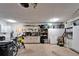 Organized garage with storage cabinets and workspace offering practicality and utility at 1710 New Bedford Dr, Sun City Center, FL 33573