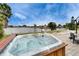 Relax in this hot tub with waterfront views, perfect for enjoying serene sunsets and outdoor relaxation at 1710 New Bedford Dr, Sun City Center, FL 33573