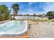 Enjoy this hot tub with views of the water in a relaxing setting with beautiful landscaping at 1710 New Bedford Dr, Sun City Center, FL 33573